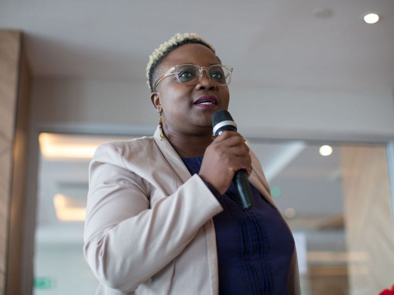 woman speaking into microphone
